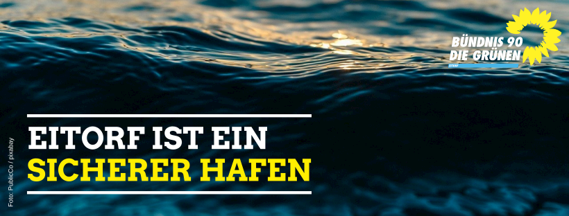 Auf dem Bild sind Meereswellen zu sehen. Darauf der Spruch: "Eitorf ist ein sicherer Hafen"